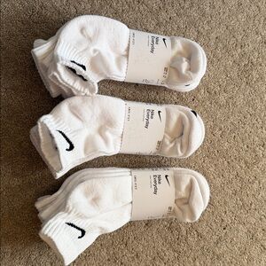 Nike DRI FIT Everyday White Crew Socks with Black Logo.